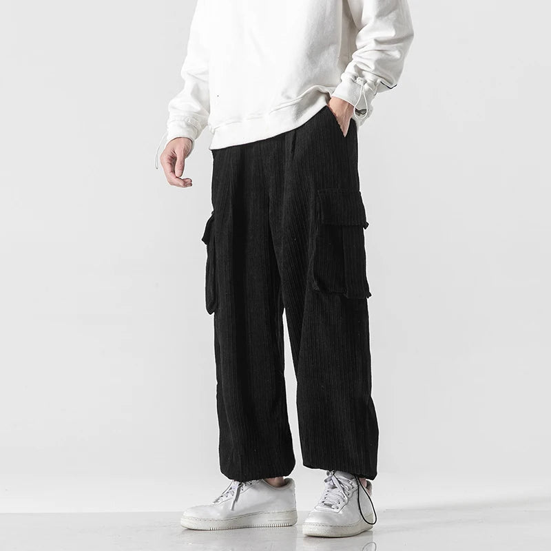 Pantalon de survêtement cargo en velours côtelé noir, coupe ample avec poches cargo et cordon de serrage