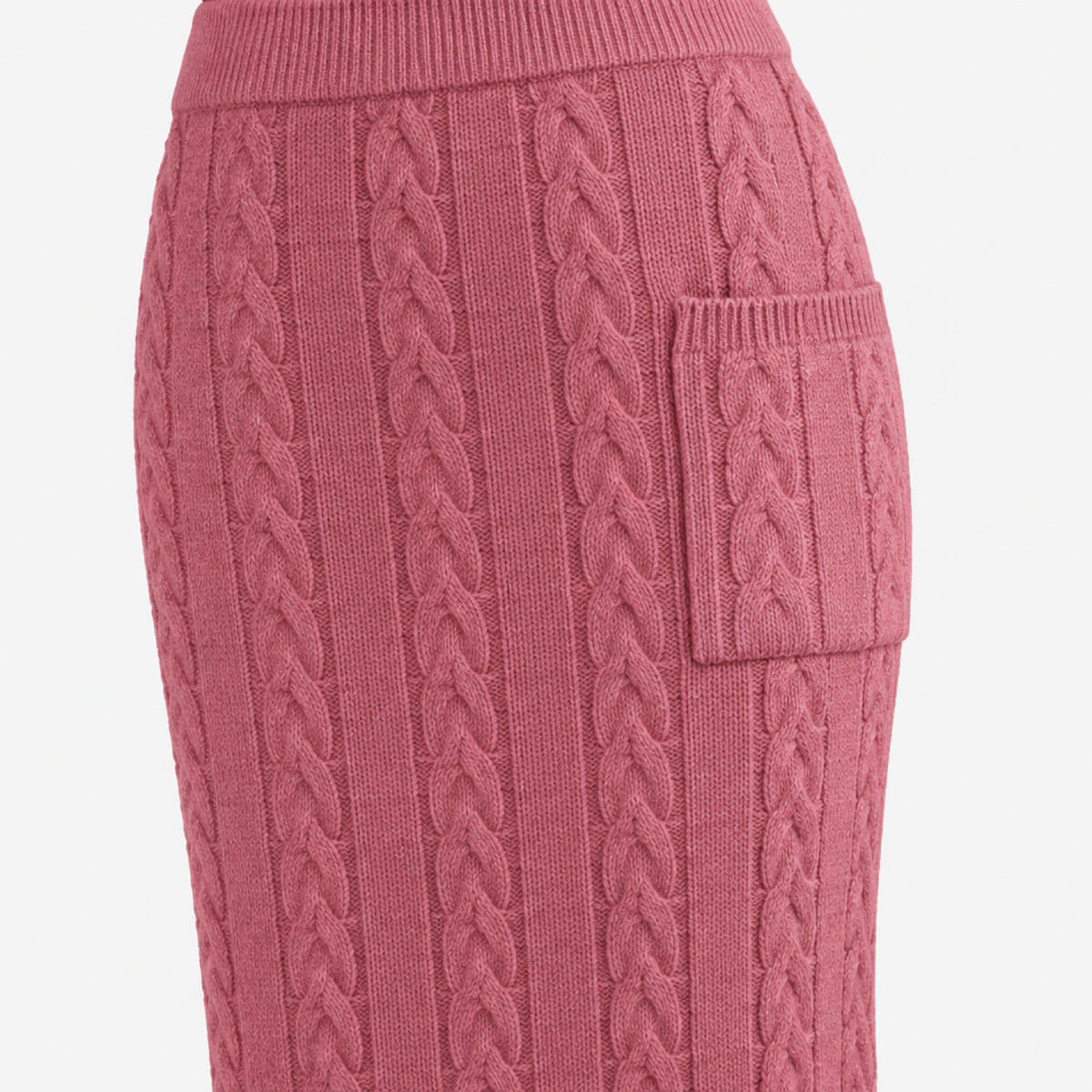 Détail de la maille torsadée et de la poche de la jupe, coloris rose
