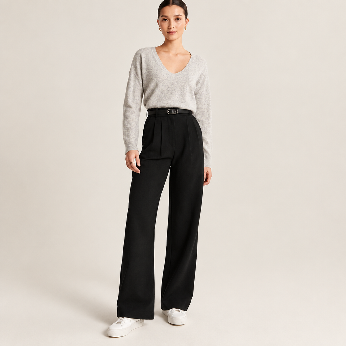 Pantalon large taille haute femme en noir, vue de face avec ceinture et pinces à la taille