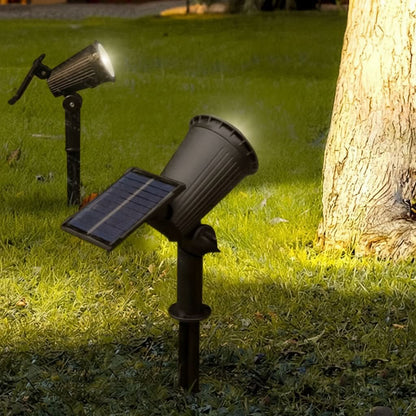 Spot solaire installé au pied d'un arbre, éclairage d'ambiance