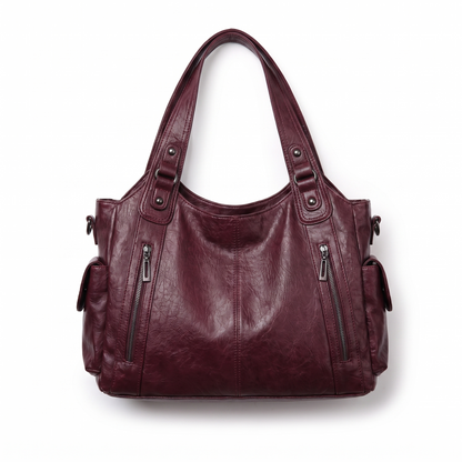 Sac à épaule en cuir faux, détail des anses supérieures