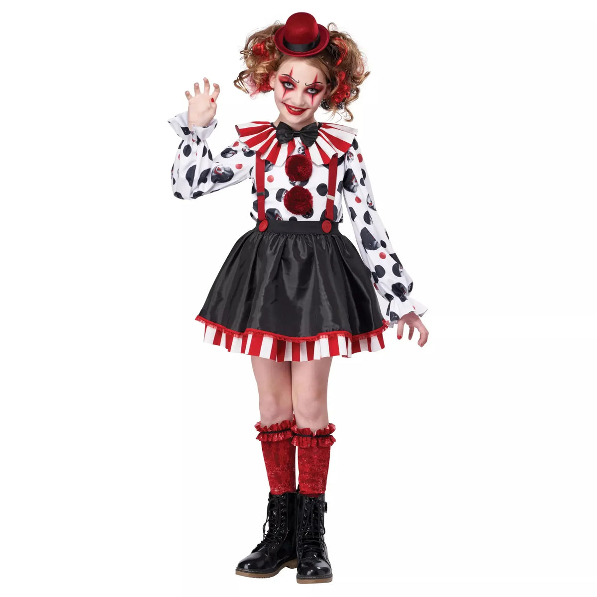 Fillette en costume de clown avec jupe noire et haut à pois