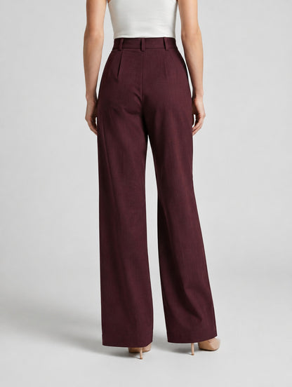 Pantalon large taille haute à plis pour femme, coloris noir, porté par une femme, vue de dos