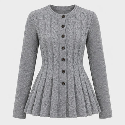 Cardigan féminin à peplum ajusté, détail du peplum gris en studio