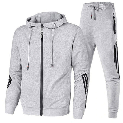 Ensemble jogging homme gris à capuche, veste zippée et pantalon bandes contrastées, vue face
