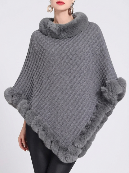 Poncho en maille oversize coloris gris avec bordure en fausse fourrure