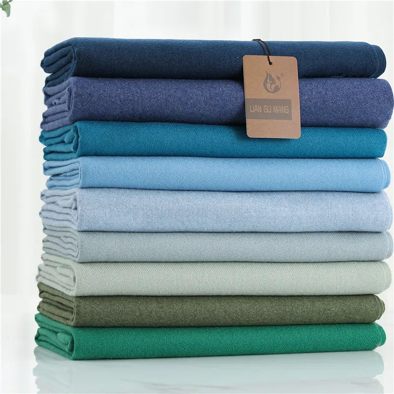 Écharpe aspect cachemire – détail pompons