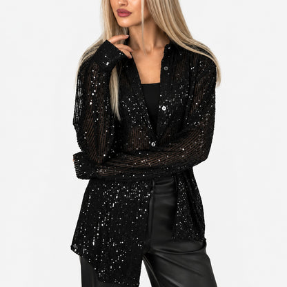 Blouse noire à rayures de paillettes semi-transparente, manches longues, vue de trois-quarts