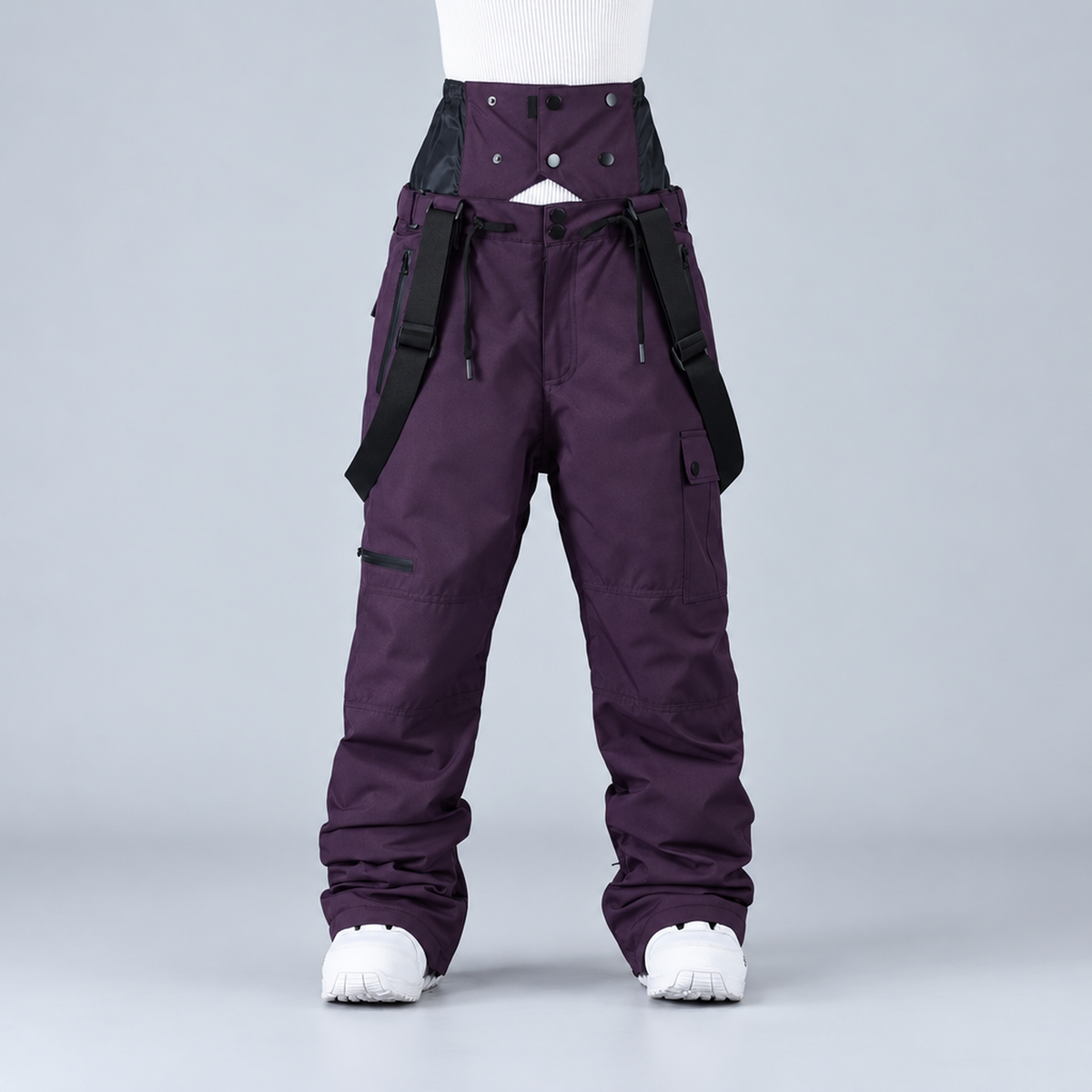 Pantalon de snowboard unisexe violet, vue de profil montrant les bretelles et les poches cargo