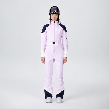 Combinaison de ski femme rose pâle, vue de face portée par un mannequin
